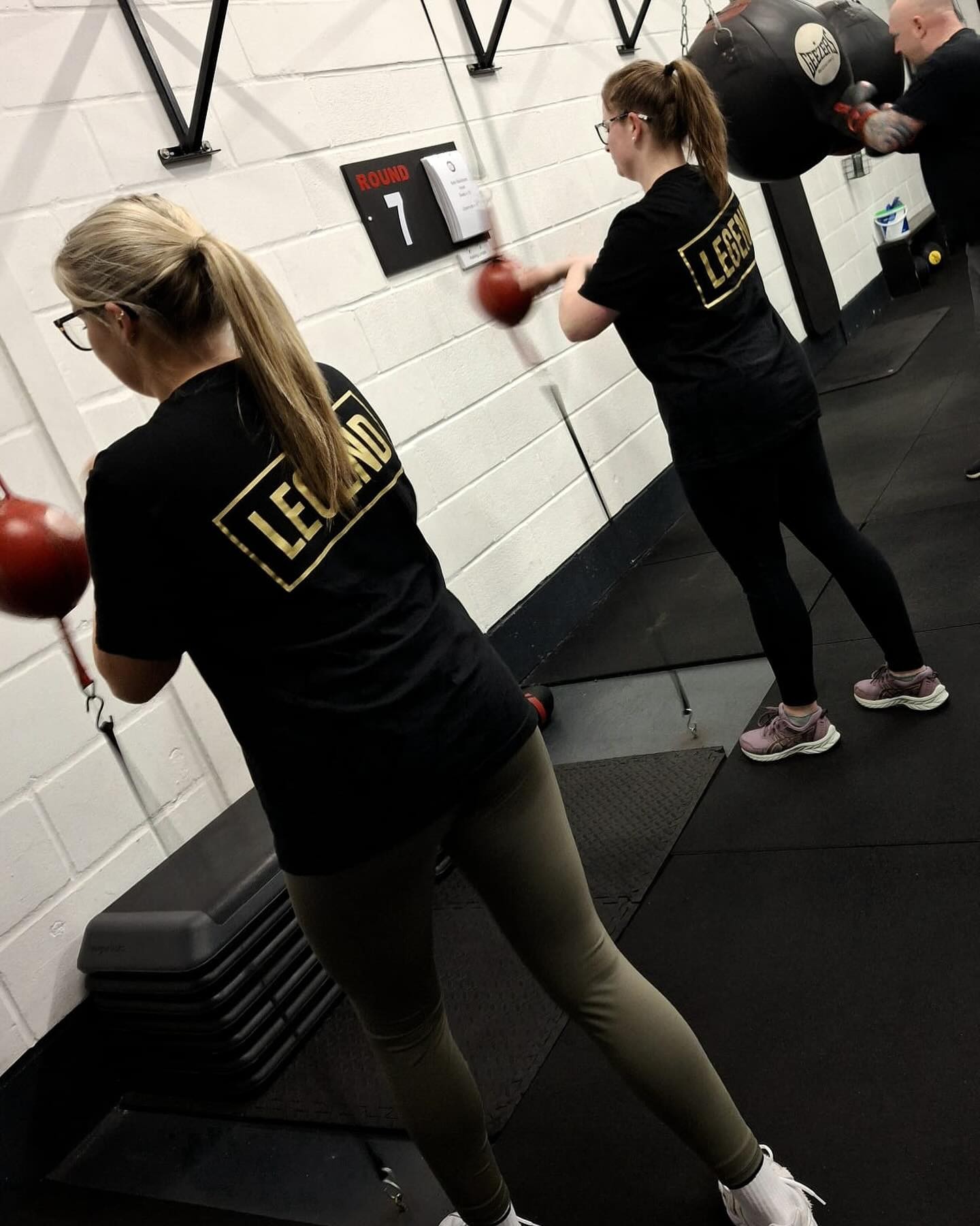 Two BOX30 members training with speed bags
