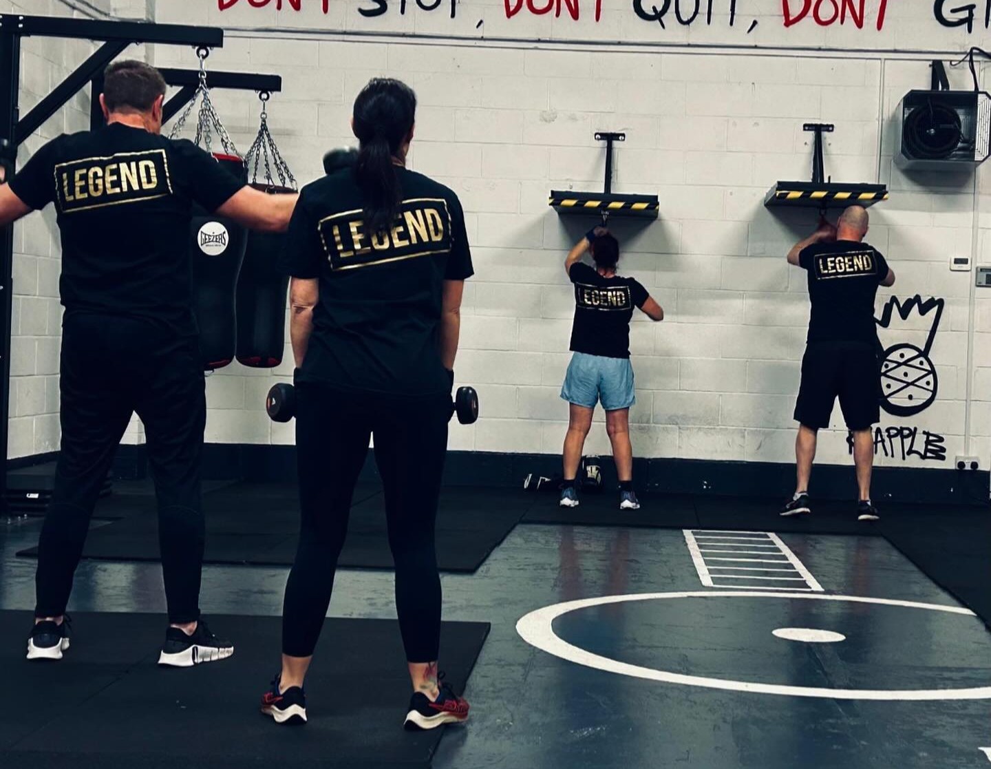 BOX30 members training at stations in the gym