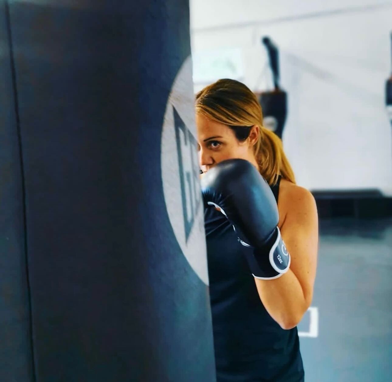 BOX30 member boxing with a heavy bag